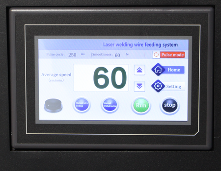 Digital display screen of a laser welding wire feeding system with various controls and settings.