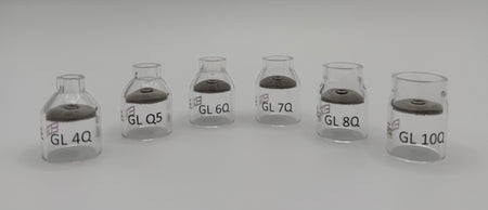 Clear glass welding gas lens cups in various sizes on a white background