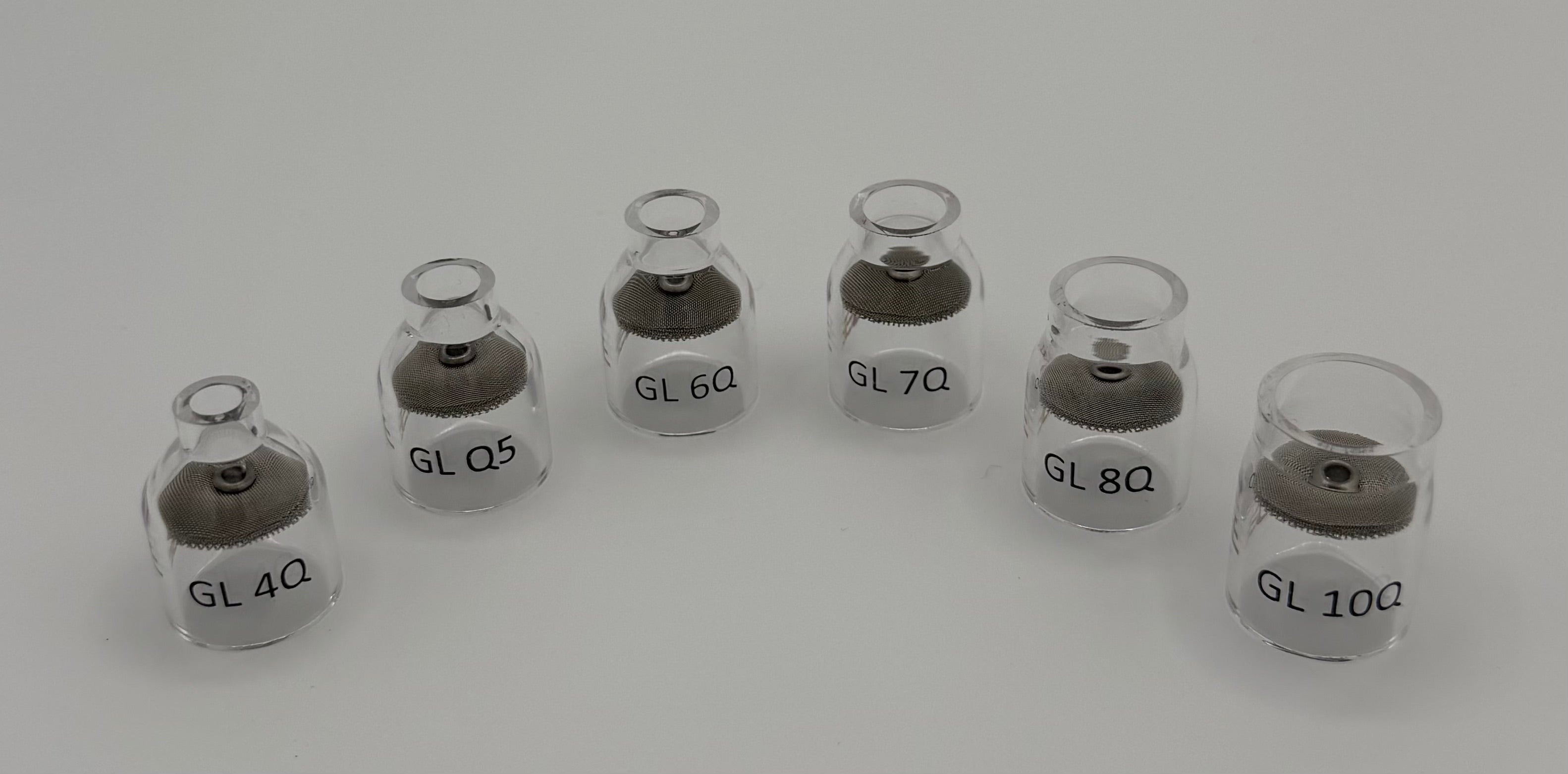 Set of clear glass welding cups with mesh diffusers labeled GL 4Q to GL 10Q on white background