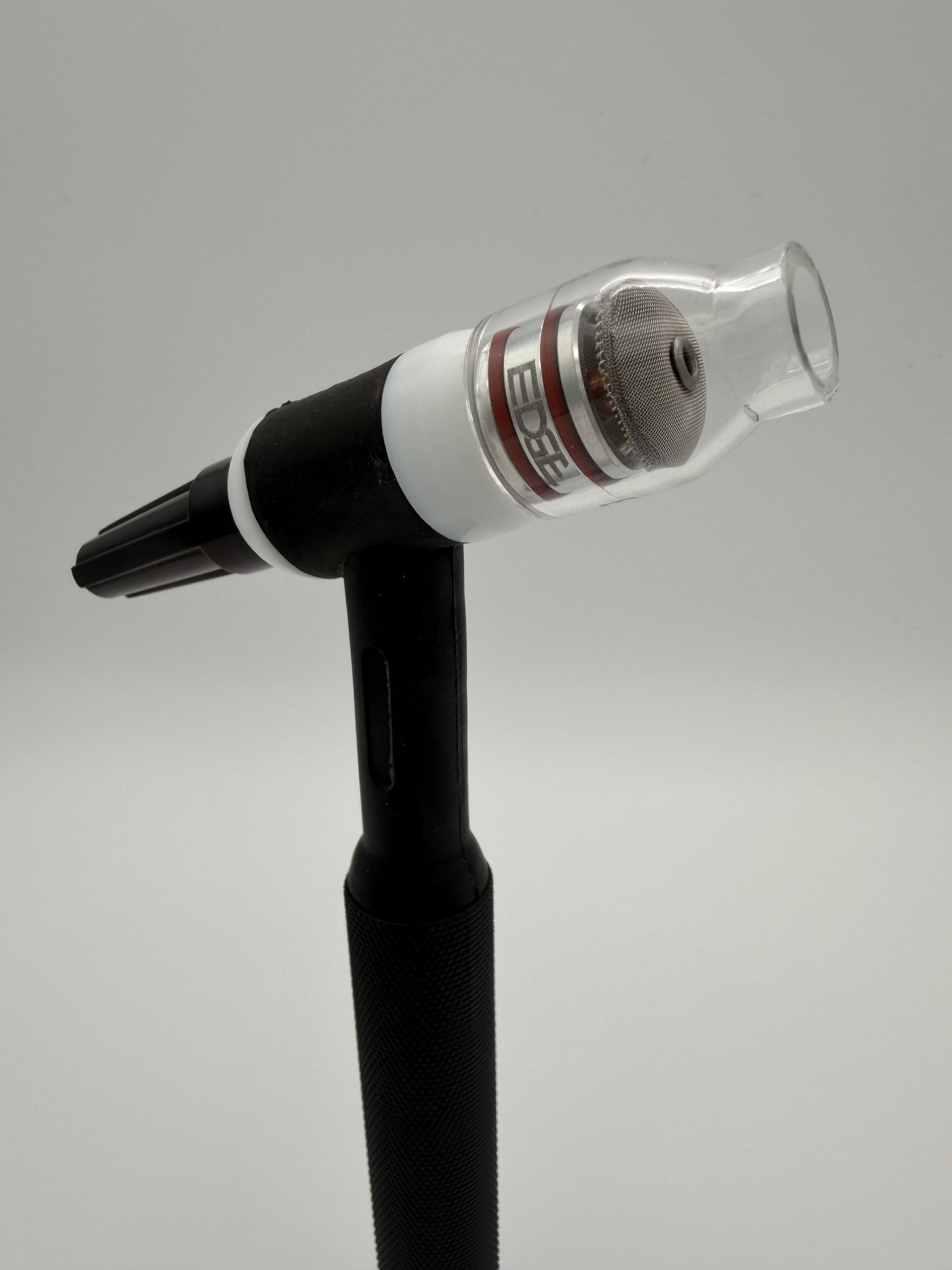 TIG welding torch with clear EDGE welding cup and mesh diffuser on white background
