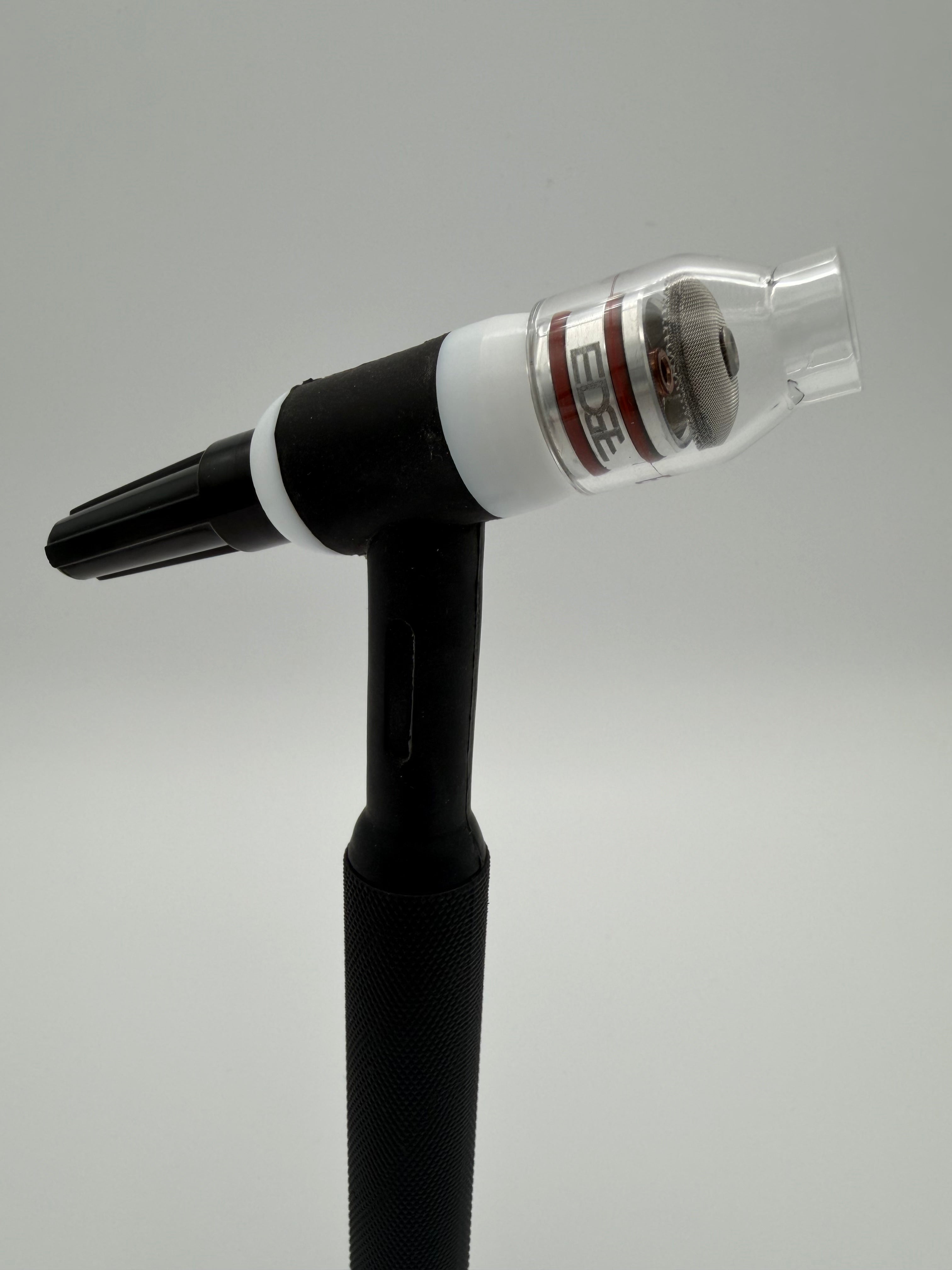 TIG torch with back cap, teflon heat shield, glass welding cup, aluminum adapter with o-rings, and mesh screen diffuser