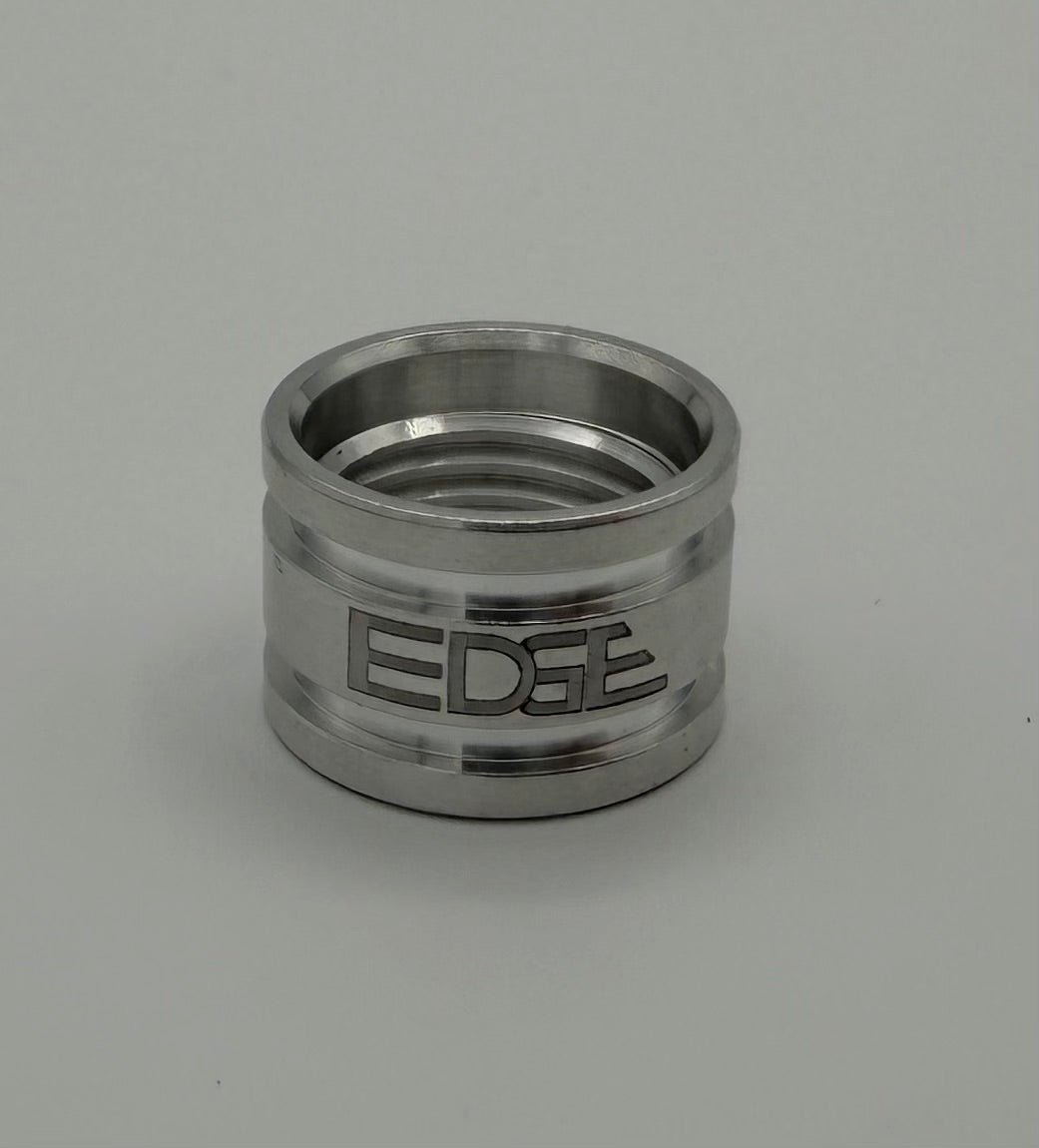 Polished metal welding adapter with engraved EDGE logo on light background