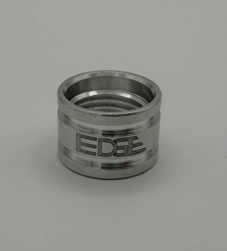 Polished metal welding adapter with engraved EDGE logo on light background