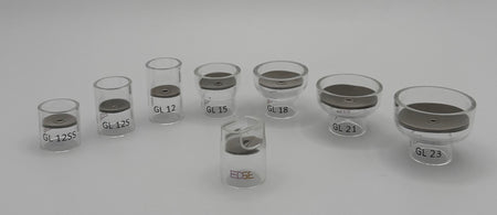 Assorted clear glass welding cups with mesh filters, labeled GL12SS to GL23, on white background