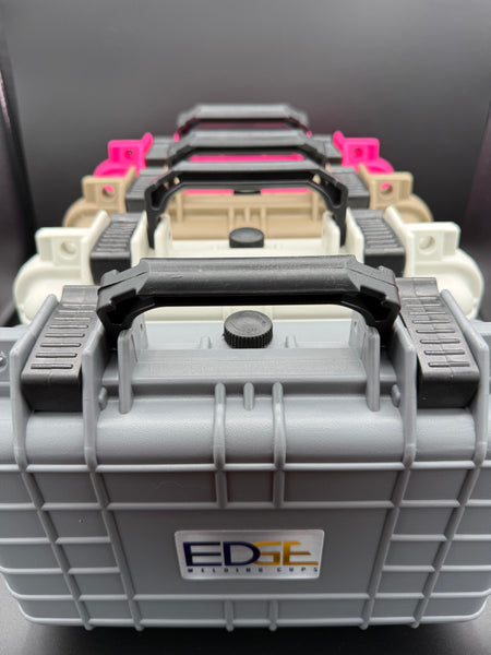 Stacked protective welding supply cases with handles in various colors, front view