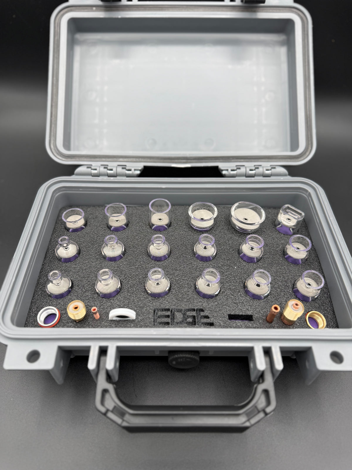 Protective case with assorted welding cups and accessories organized in foam insert
