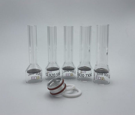 Clear glass welding cups with metal screens and o-rings on a white background
